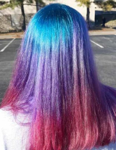Pink and purple hair coloring by New Dimensions School of Hair Design